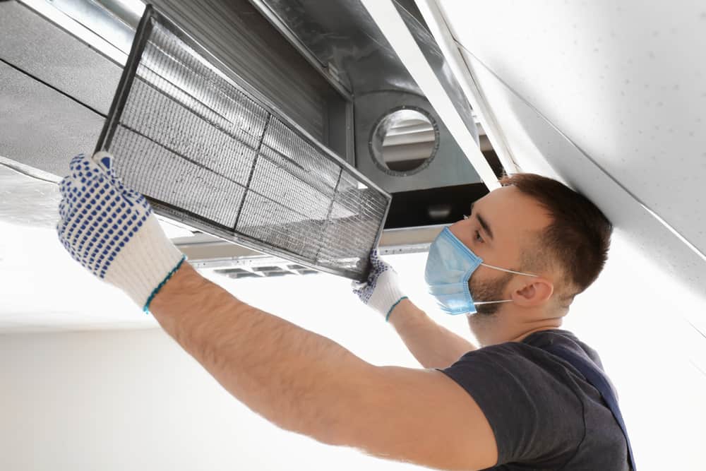 male technician opening a vent